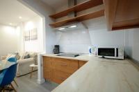 Televízia a/alebo spoločenská miestnosť v ubytovaní Livingtarifa Apartamento Coco