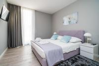 Posteľ alebo postele v izbe v ubytovaní Apartments ZoomZoom