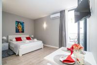 Posteľ alebo postele v izbe v ubytovaní Apartments ZoomZoom