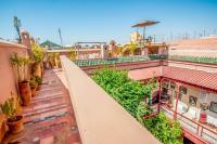 an overhead view of a balcony of a building with plants at Riad Chorfa in Marrakesh
