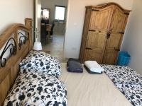Postel nebo postele na pokoji v ubytování Priscilla Apartment