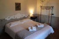 A bed or beds in a room at Agriturismo Mancassola