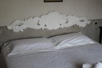 A bed or beds in a room at Agriturismo Mancassola