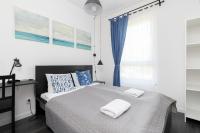 Posteľ alebo postele v izbe v ubytovaní Nowa Letnica Apartments by Noclegi Renters