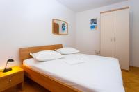 Posteľ alebo postele v izbe v ubytovaní Apartmani Vranjes