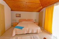 Postel nebo postele na pokoji v ubytování Paradise Town Villa Orchard
