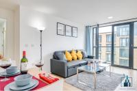a living room with a couch and a glass table at City View Apartments Birmingham City Centre in Birmingham
