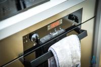 a oven with a towel hanging on the handle at City View Apartments Birmingham City Centre in Birmingham