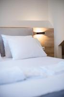 A bed or beds in a room at Chrysanthi's Apartment