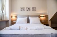 A bed or beds in a room at Chrysanthi's Apartment