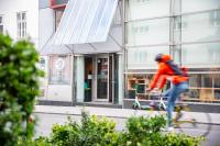 a person riding a skateboard in front of a building at Hotel Korotan in Vienna