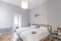 A bed or beds in a room at Casa Rural La Rosaleda de Pajares