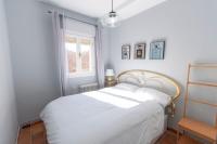 A bed or beds in a room at Casa Rural La Rosaleda de Pajares