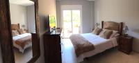 Posteľ alebo postele v izbe v ubytovaní Apartamento de lujo en puerto Santiago 1