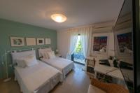 Postel nebo postele na pokoji v ubytování Villa Waves - Agios Nikolaos Anavyssos
