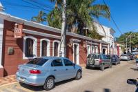 a blue car parked on the side of a street at Pousada Boulevard in Cabo Frio