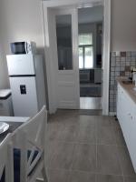 A kitchen or kitchenette at Jade Vendégház