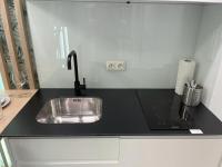 A kitchen or kitchenette at ZEUS DESIGN Mini Studio Vienna #5a