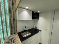 A kitchen or kitchenette at ZEUS DESIGN Mini Studio Vienna #5a