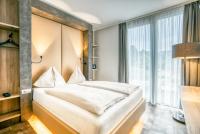 Posteľ alebo postele v izbe v ubytovaní Rocket Rooms Velden