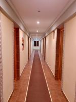 a corridor in a building with a long hallway at Hotel Nalba Jupiter in Jupiter