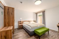 A bed or beds in a room at Landgasthof Bierfriedl