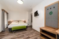 A bed or beds in a room at Landgasthof Bierfriedl