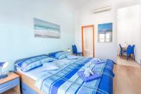 Posteľ alebo postele v izbe v ubytovaní Apartments Ivanović