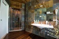 a bathroom with a sink and a shower at Tree Lake B&amp;B Hualien in Shuhu