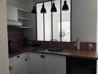 a kitchen with a sink and a window at Colibri Appart&#39; T2 au coeur du Bassin d&#39;Arcachon in Gujan-Mestras