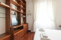 Televízia a/alebo spoločenská miestnosť v ubytovaní De Angeli Cozy Apartment- Youhosty