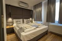 Posteľ alebo postele v izbe v ubytovaní Minaret Residence & Relax Pécs