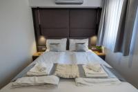 Posteľ alebo postele v izbe v ubytovaní Minaret Residence & Relax Pécs