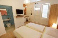 Posteľ alebo postele v izbe v ubytovaní Zadar Street Apartments and Room