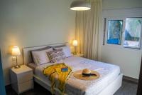 A bed or beds in a room at Istron Avra