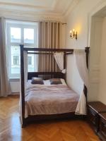 Posteľ alebo postele v izbe v ubytovaní Prestige Aparthotel Piotrkowska 82 - wyjątkowy widok na deptak