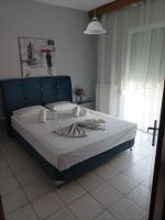 Postel nebo postele na pokoji v ubytování Dimitra Apartments