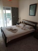 Postel nebo postele na pokoji v ubytování Dimitra Apartments