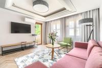 Telewizja i/lub zestaw kina domowego w obiekcie City Apartments - Apartamenty Butikowe