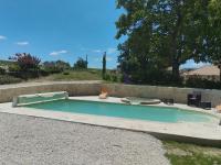 a small swimming pool with chairs in a yard at Gîte de caractère en pleine nature in Bourg-de-Visa