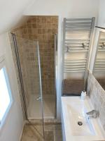 a bathroom with a shower and a sink at Au coin des Hospices in Beaune