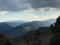 a view of a valley with mountains in the distance at Maison LGBT des Monts Bleus in Saint-Roman-de-Tousque