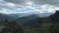 a view of a valley with mountains in the distance at Maison LGBT des Monts Bleus in Saint-Roman-de-Tousque