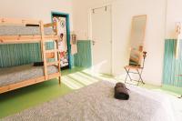 Postel nebo postele na pokoji v ubytování Hospedium Hostel República Surf House