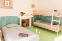 Postel nebo postele na pokoji v ubytování Hospedium Hostel República Surf House