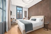 Postel nebo postele na pokoji v ubytování Hellenic Vibes Smart Hotel