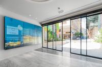 TV a/nebo společenská místnost v ubytování Hellenic Vibes Smart Hotel