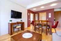 Televízia a/alebo spoločenská miestnosť v ubytovaní Zakopane Apartamenty LUX