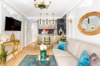 a living room with a couch and a table at Luxury 2 Bedroom 2,5 Bathroom Apartment - Champs Elysees in Paris