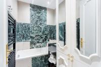 a bathroom with a green marble wall at Luxury 2 Bedroom 2,5 Bathroom Apartment - Champs Elysees in Paris